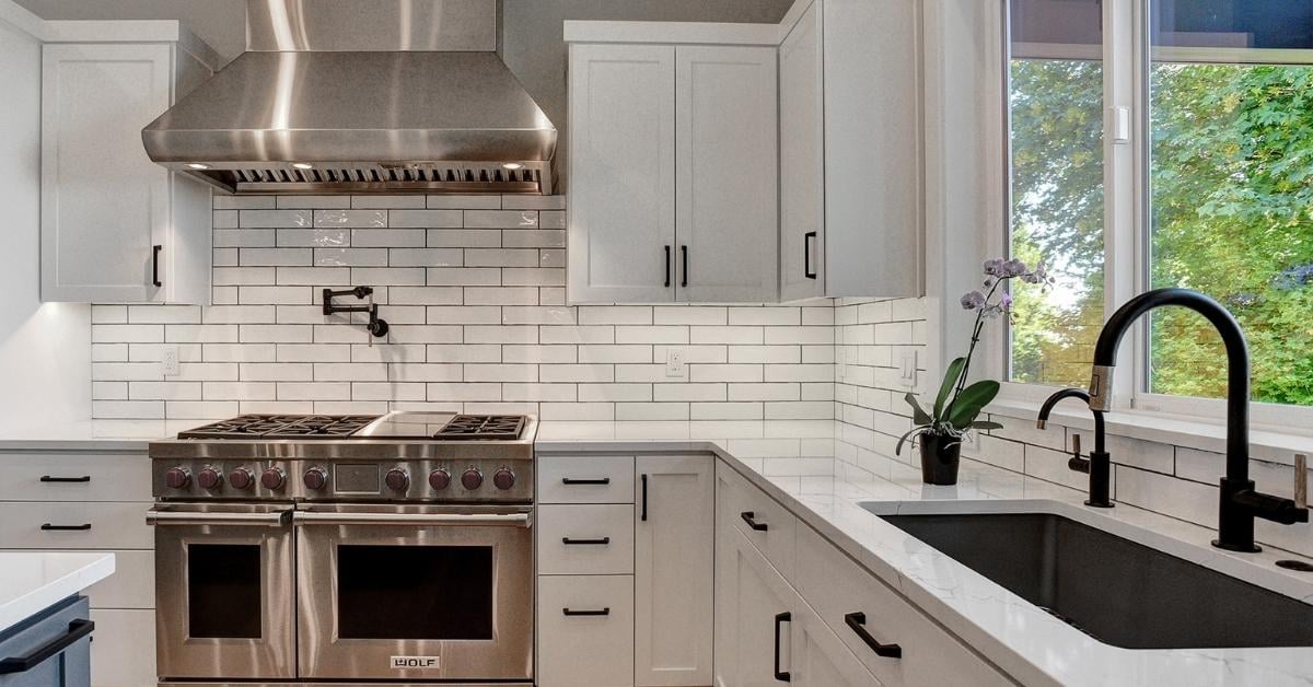 Timeless kitchen with subway tile and white cabinetry.