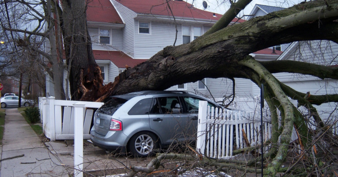 Home and car with winter storm damage
