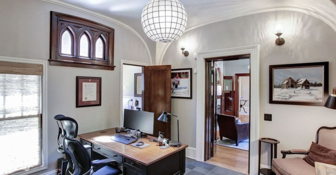 room with dark, ornate window trim